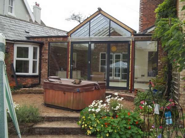 Mr & Mrs E, West Kirby, Wirral : Centor C1 double glazed Bi-fold doors with marine finish. With a combination Allstyle gable ended double glazed point. Aluminium spared ATS roof system with double glazed celsius glass.